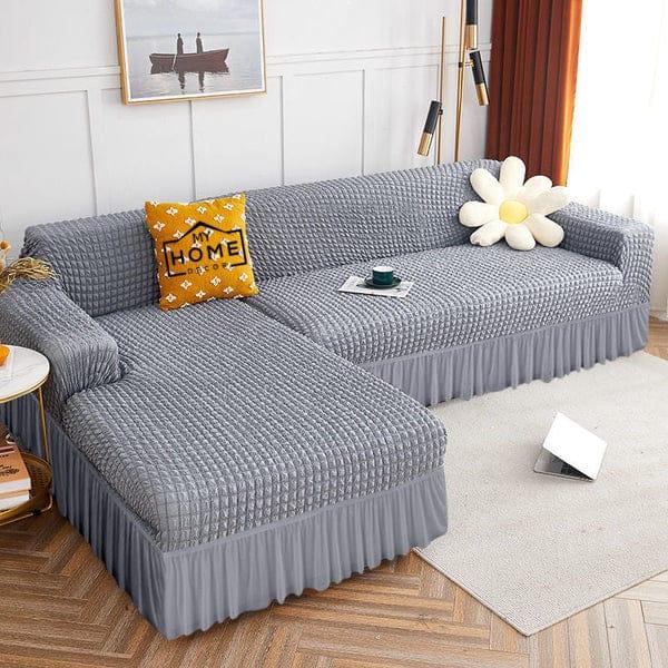 L-Shape Bubble Jacquard Sofa Cover featuring luxurious bubble texture, ruffle skirt hem, and 4-way stretch Lycra cotton blend for a snug, wrinkle-free fit. Machine washable, perfect for modern sofas.
